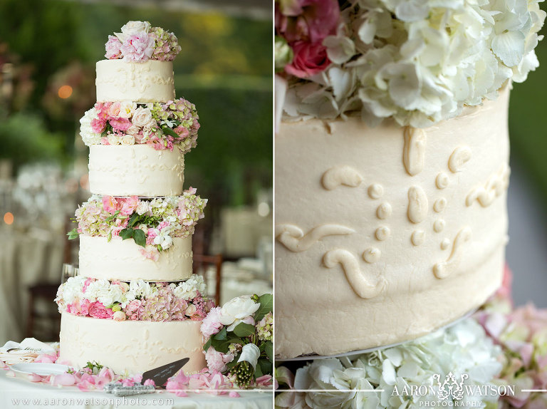 4 teared cake decorated with pink flowers 